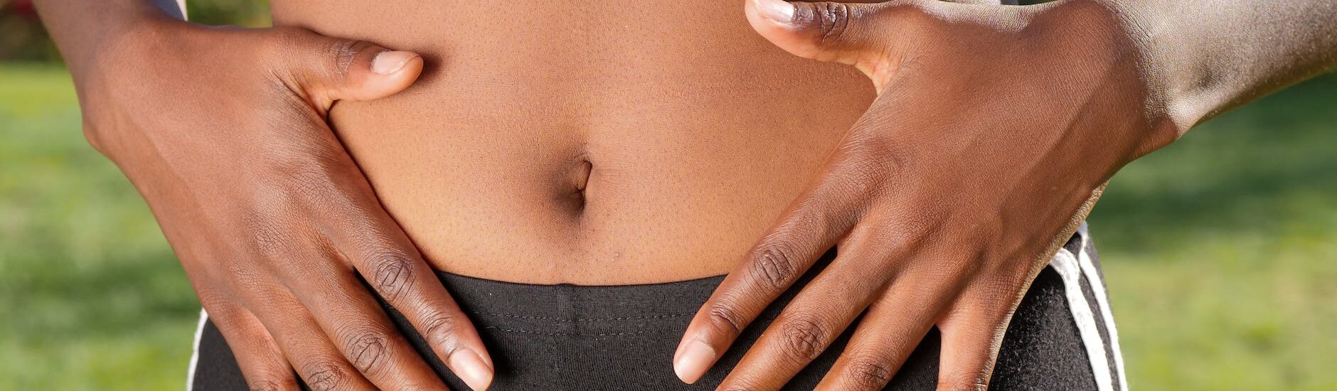a person touching her belly